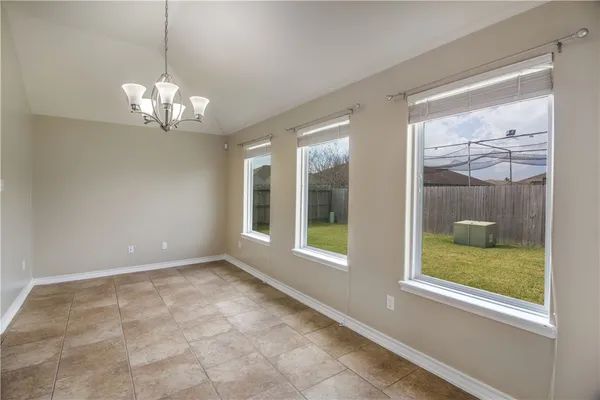 a view of a windows and chandelier in a room