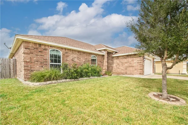 front view of a house with a big yard