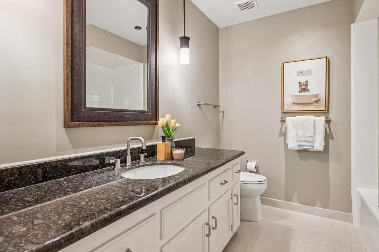 404 Ridge Gate Road Orinda, CA 94563 - Photo 13 of 27 a bathroom with a granite countertop sink and a mirror