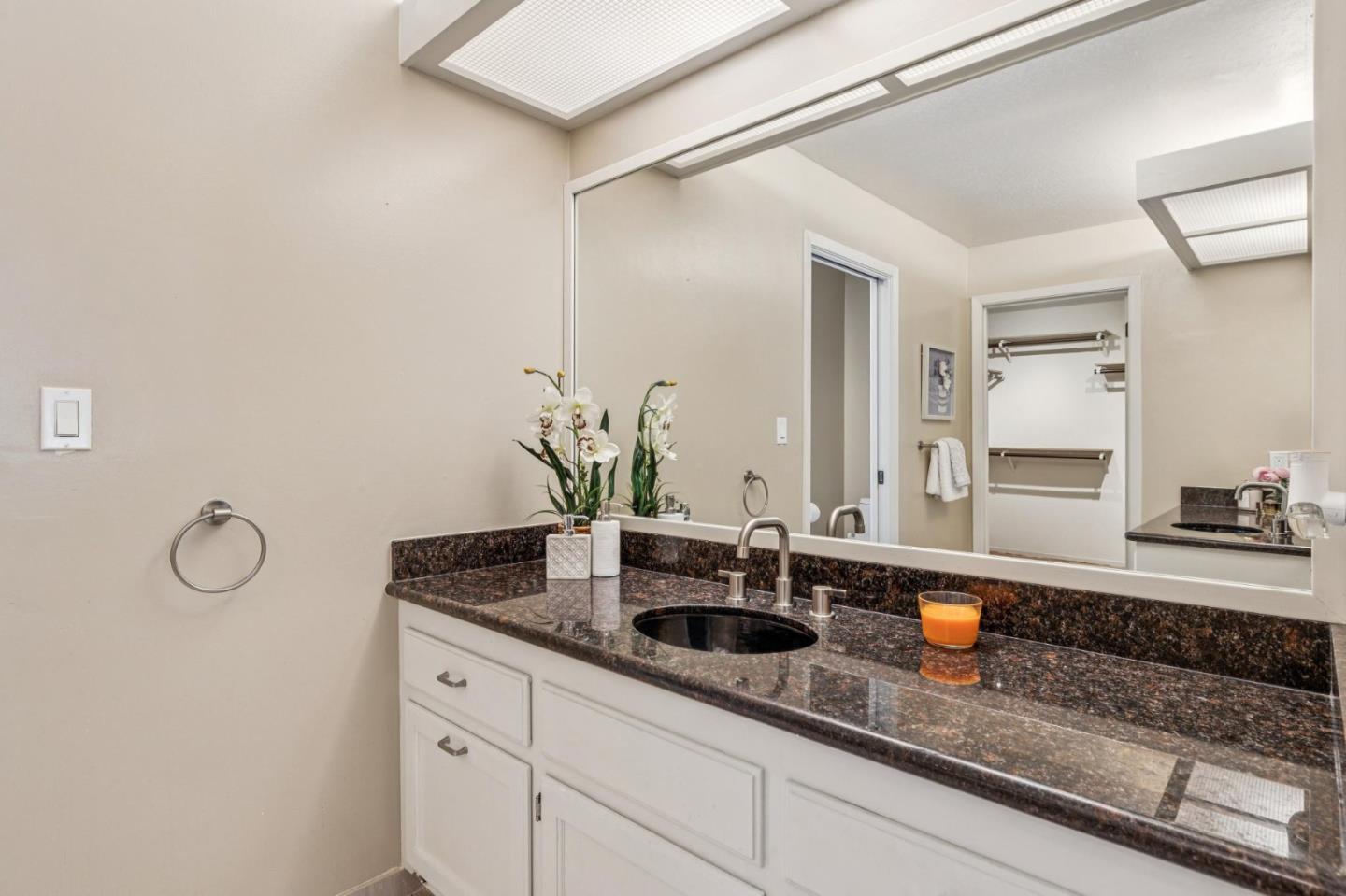 404 Ridge Gate Road Orinda, CA 94563 - Photo 9 of 27 a bathroom with a sink and a mirror
