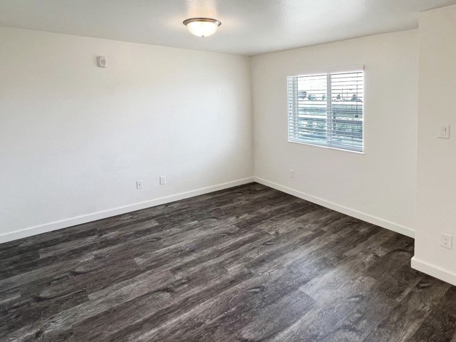 21155 Gosling Road, Unit 33AD Spring, TX 77388 - Photo 5 of 22 an empty room with wooden floor and windows