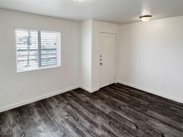21155 Gosling Road, Unit 33AD Spring, TX 77388 - Photo 6 of 22 a view of an empty room with wooden floor and a window