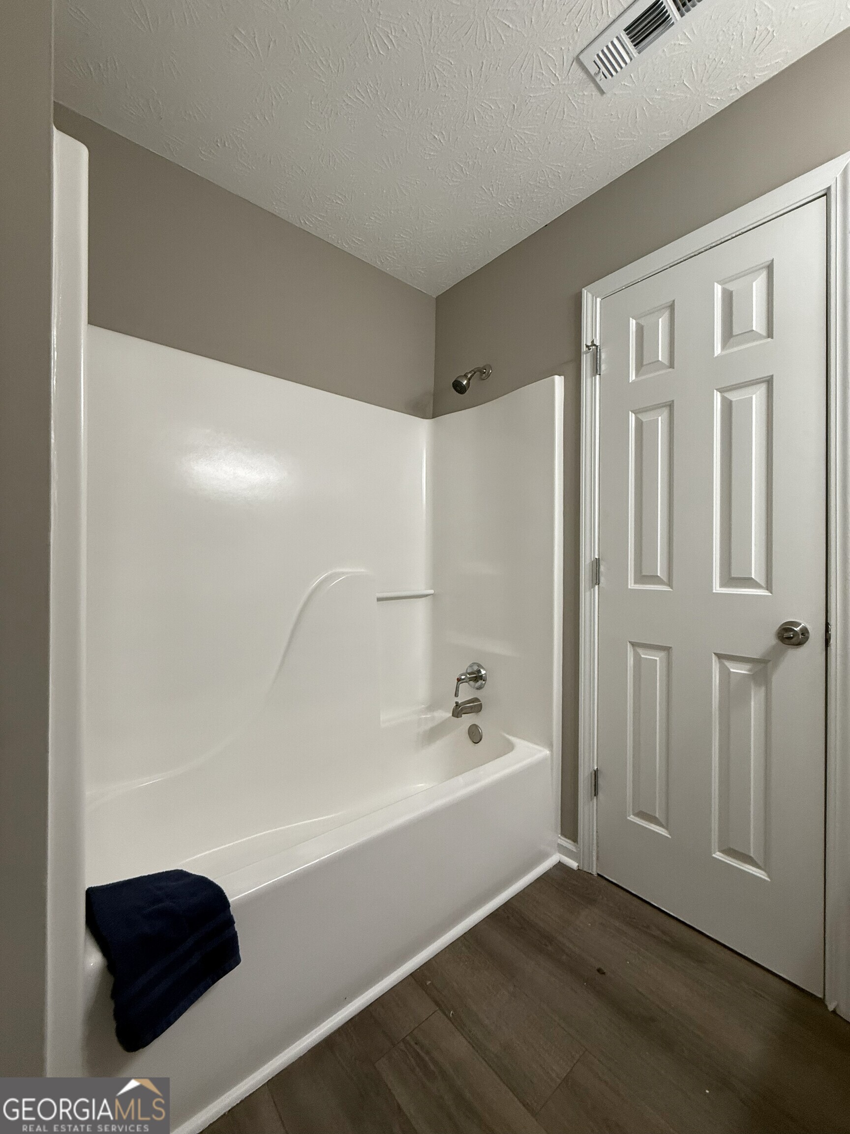1528 Willow Gate Way Auburn, GA 30011 - Photo 12 of 24 a bathroom with a bathtub and a shower