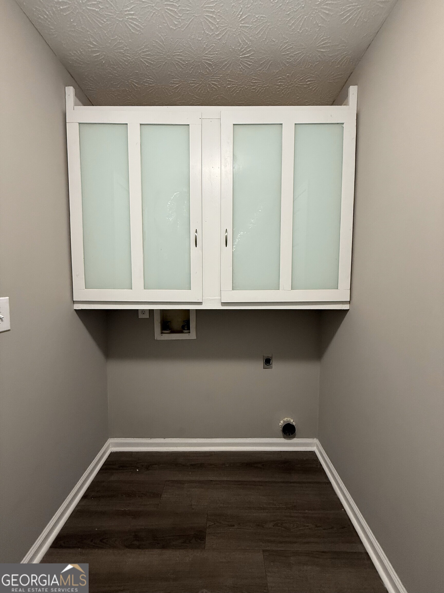 1528 Willow Gate Way Auburn, GA 30011 - Photo 13 of 24 a view of an empty room with wooden floor and a window