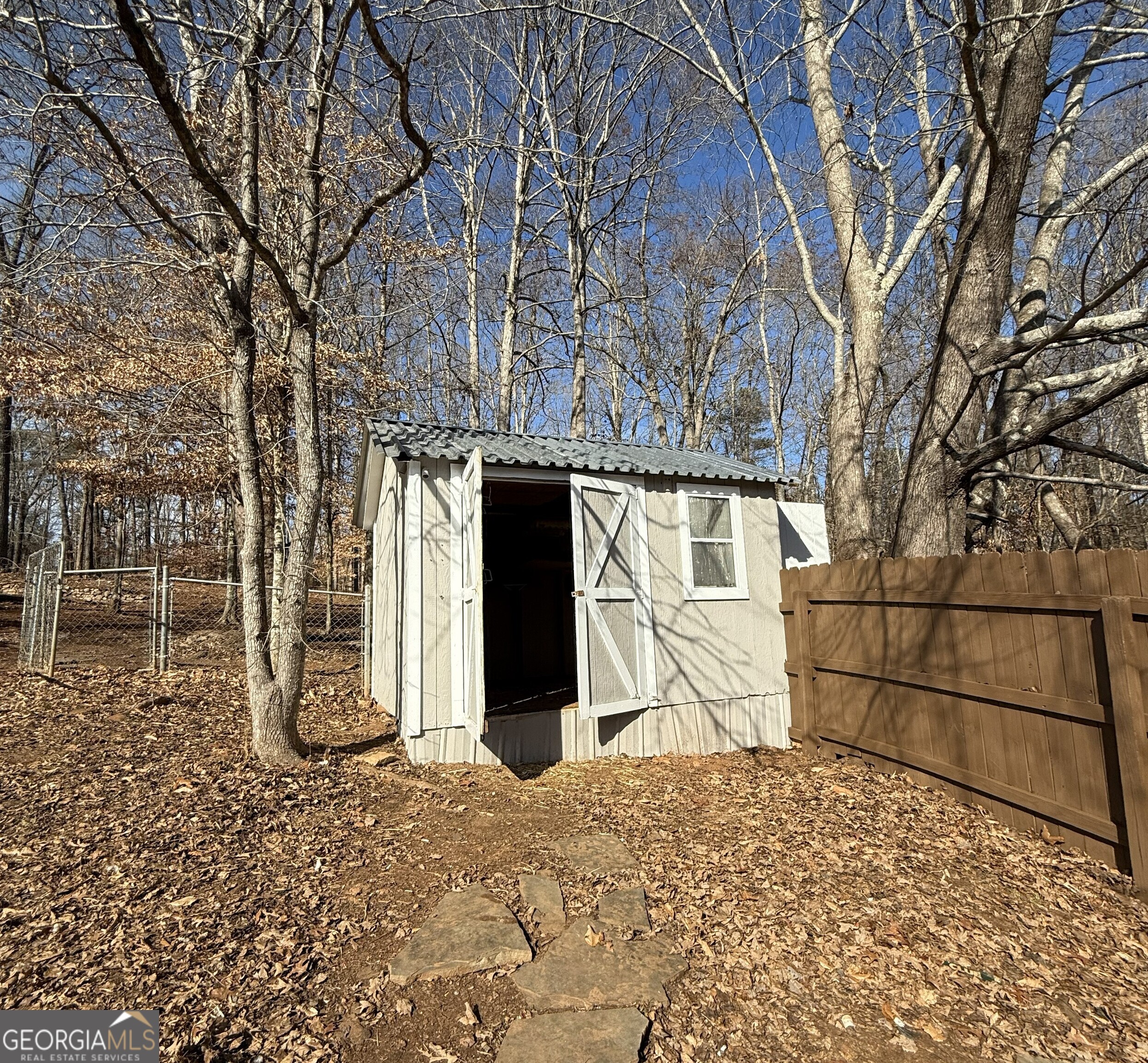 1528 Willow Gate Way Auburn, GA 30011 - Photo 15 of 24 a front view of a house with a tree