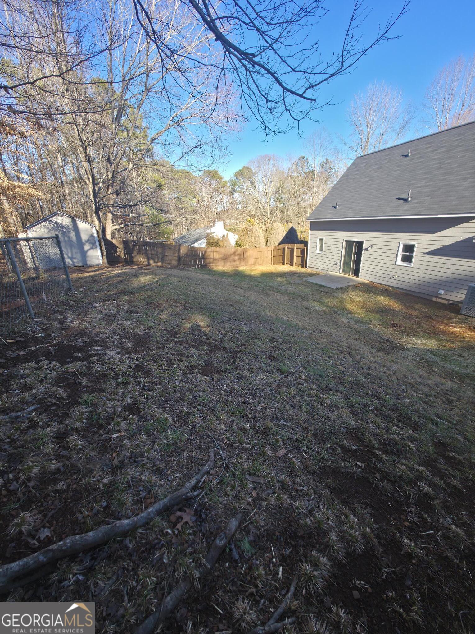 1528 Willow Gate Way Auburn, GA 30011 - Photo 20 of 24 a view of a house with a yard