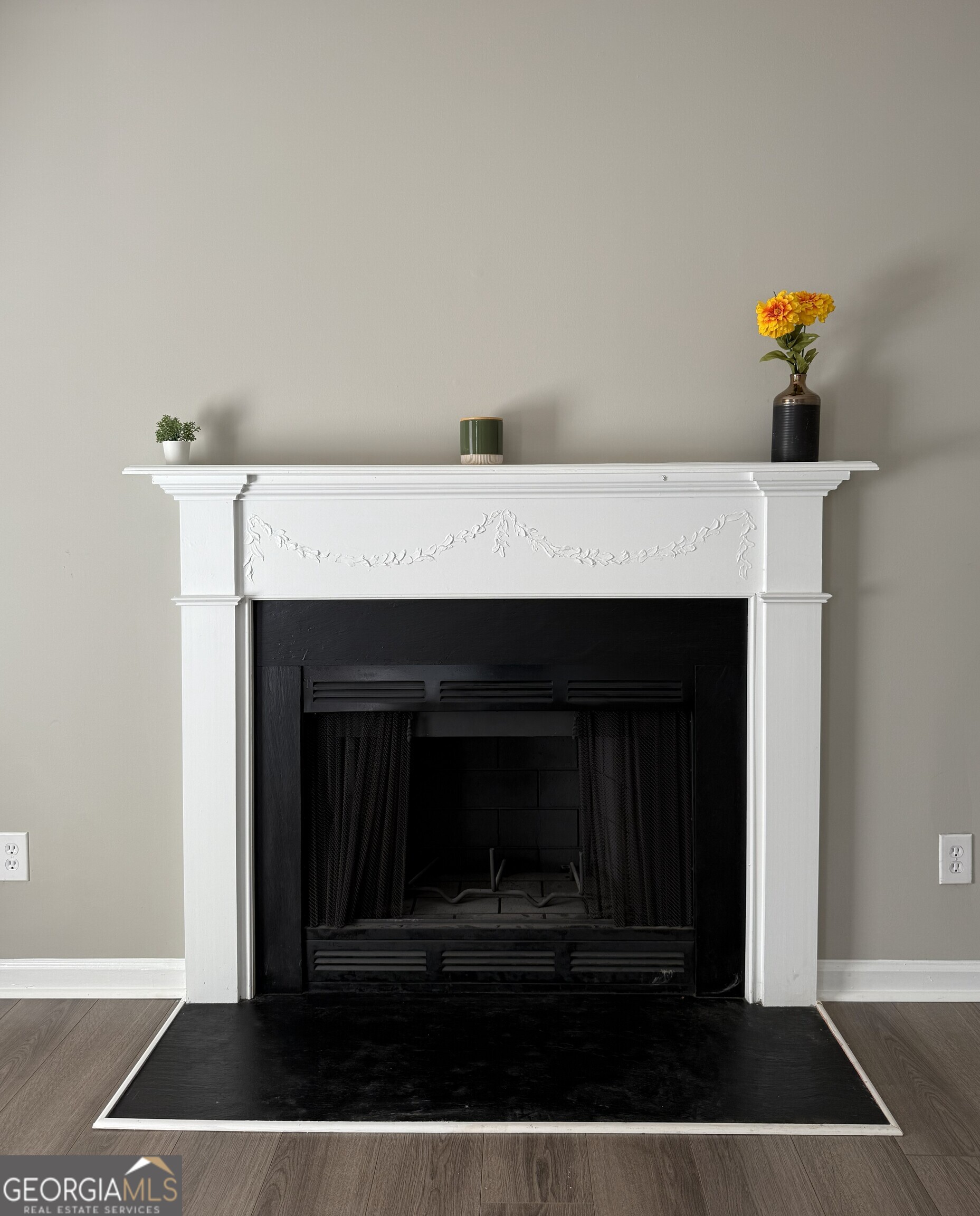 1528 Willow Gate Way Auburn, GA 30011 - Photo 3 of 24 a living room with a fireplace and a table