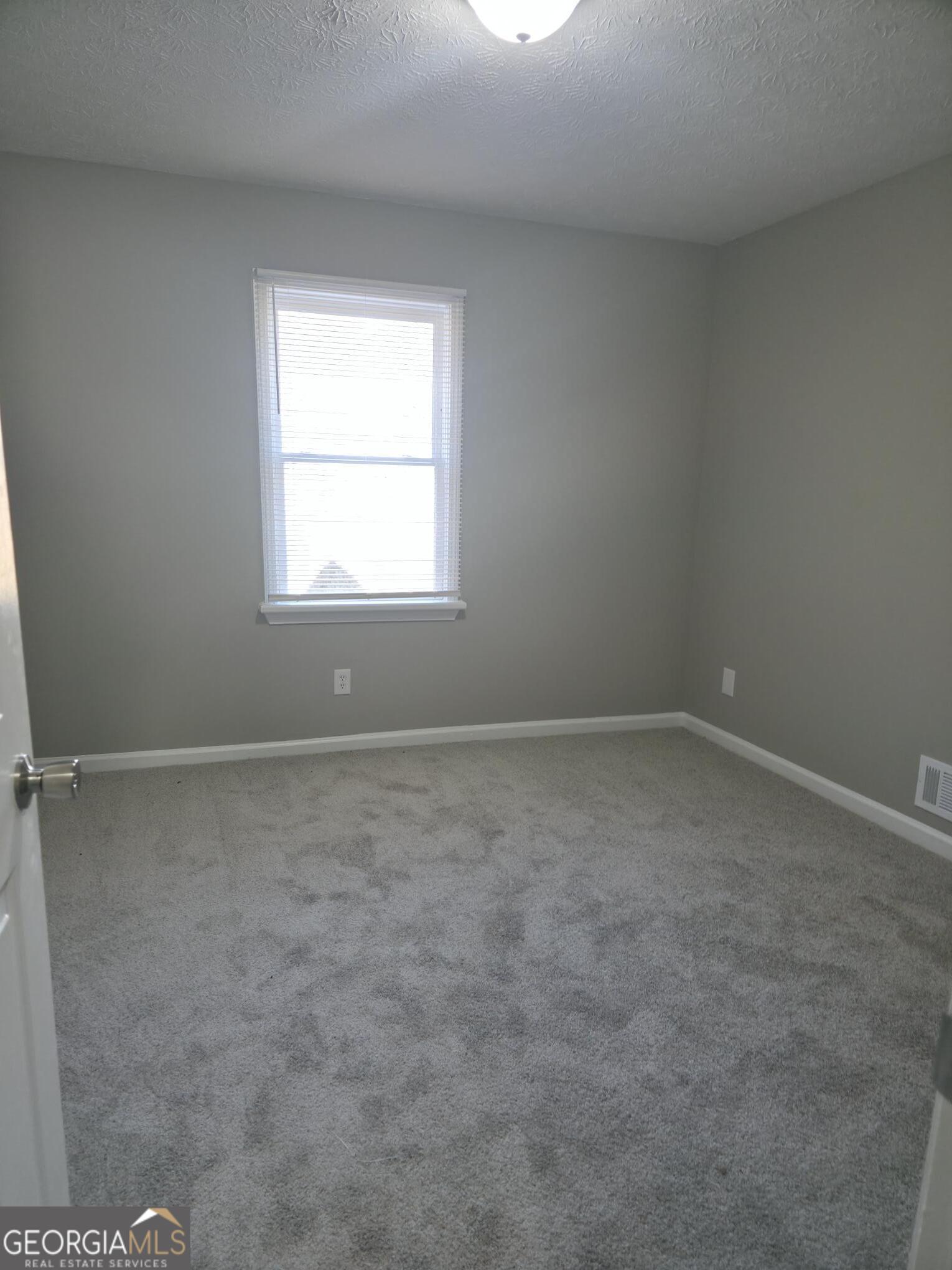 1528 Willow Gate Way Auburn, GA 30011 - Photo 10 of 24 an empty room with a window