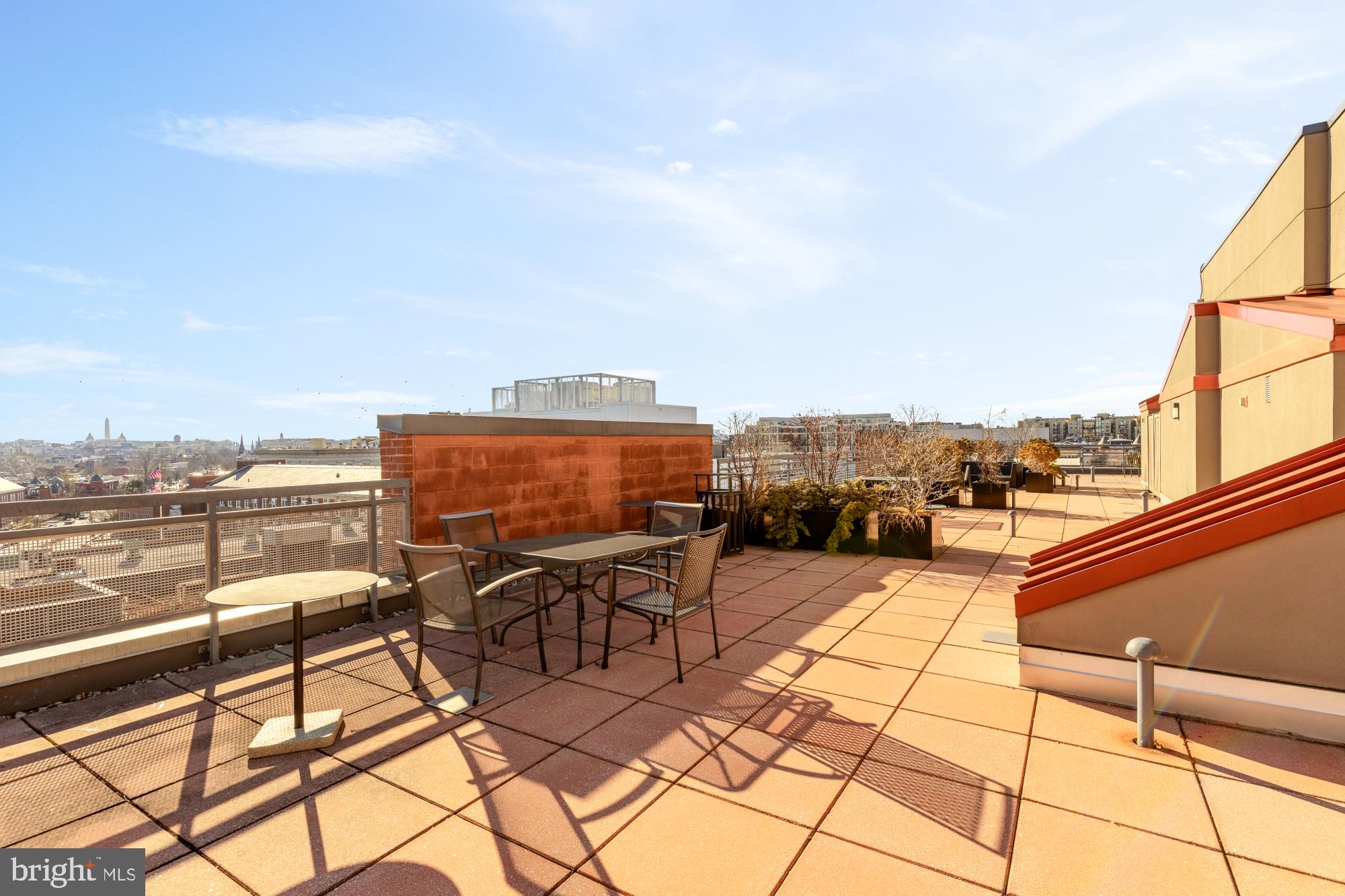 2120 Vermont Avenue Northwest, Unit 411 Washington, DC 20001 - Photo 23 of 27 a terrace with outdoor seating and city view