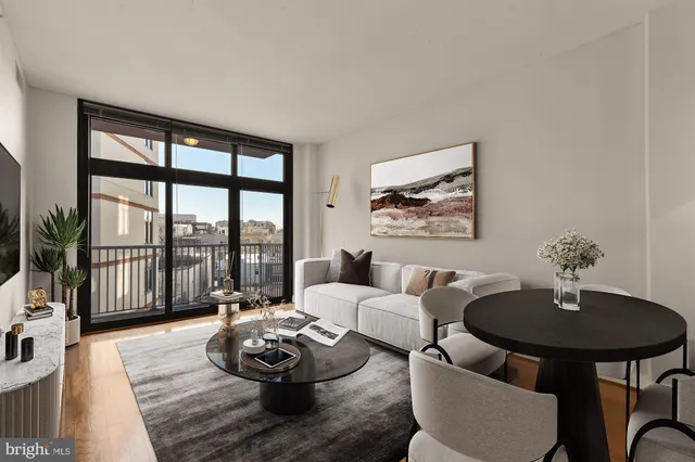 a living room with furniture and a table