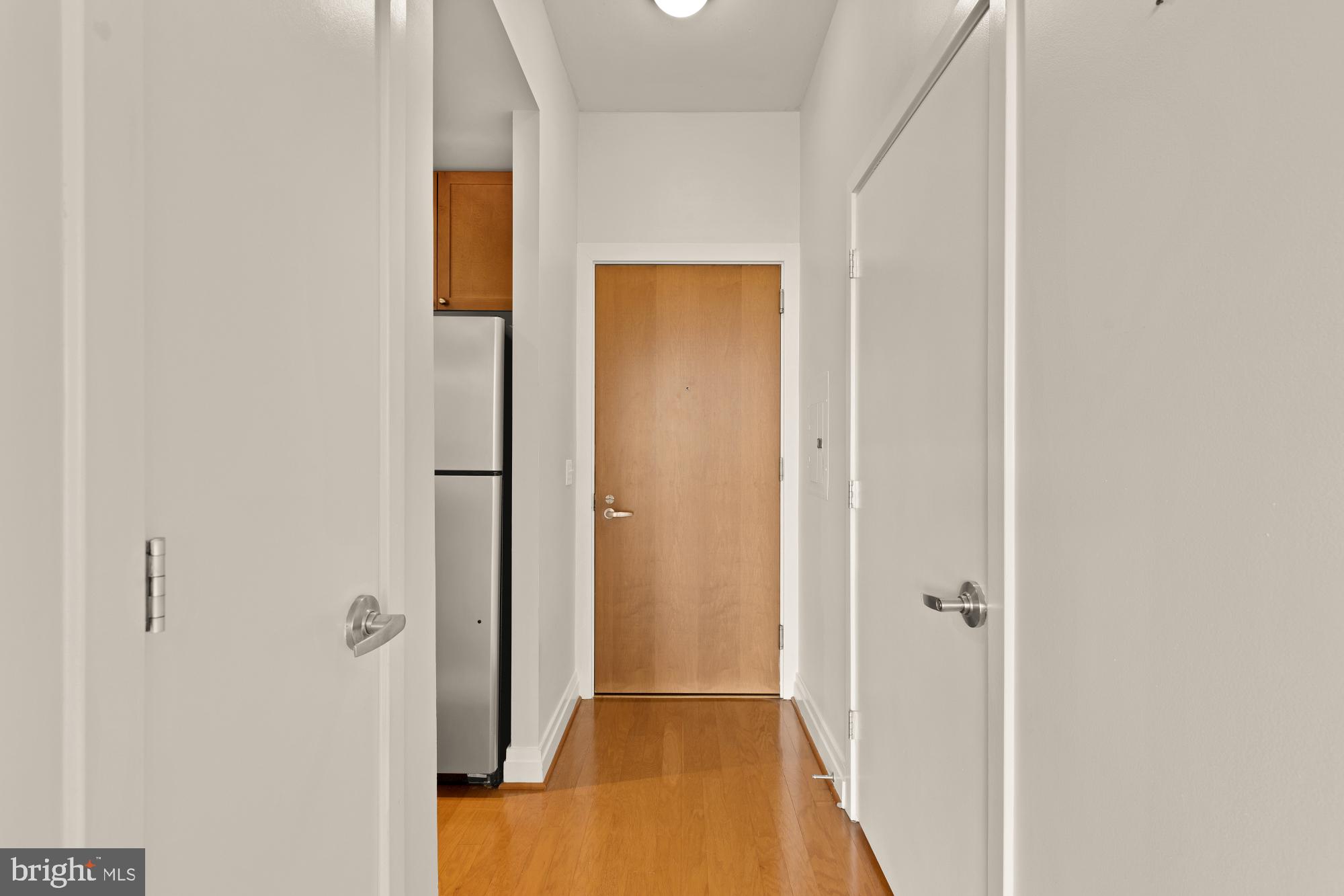 2120 Vermont Avenue Northwest, Unit 411 Washington, DC 20001 - Photo 10 of 27 a view of a hallway with wooden floor
