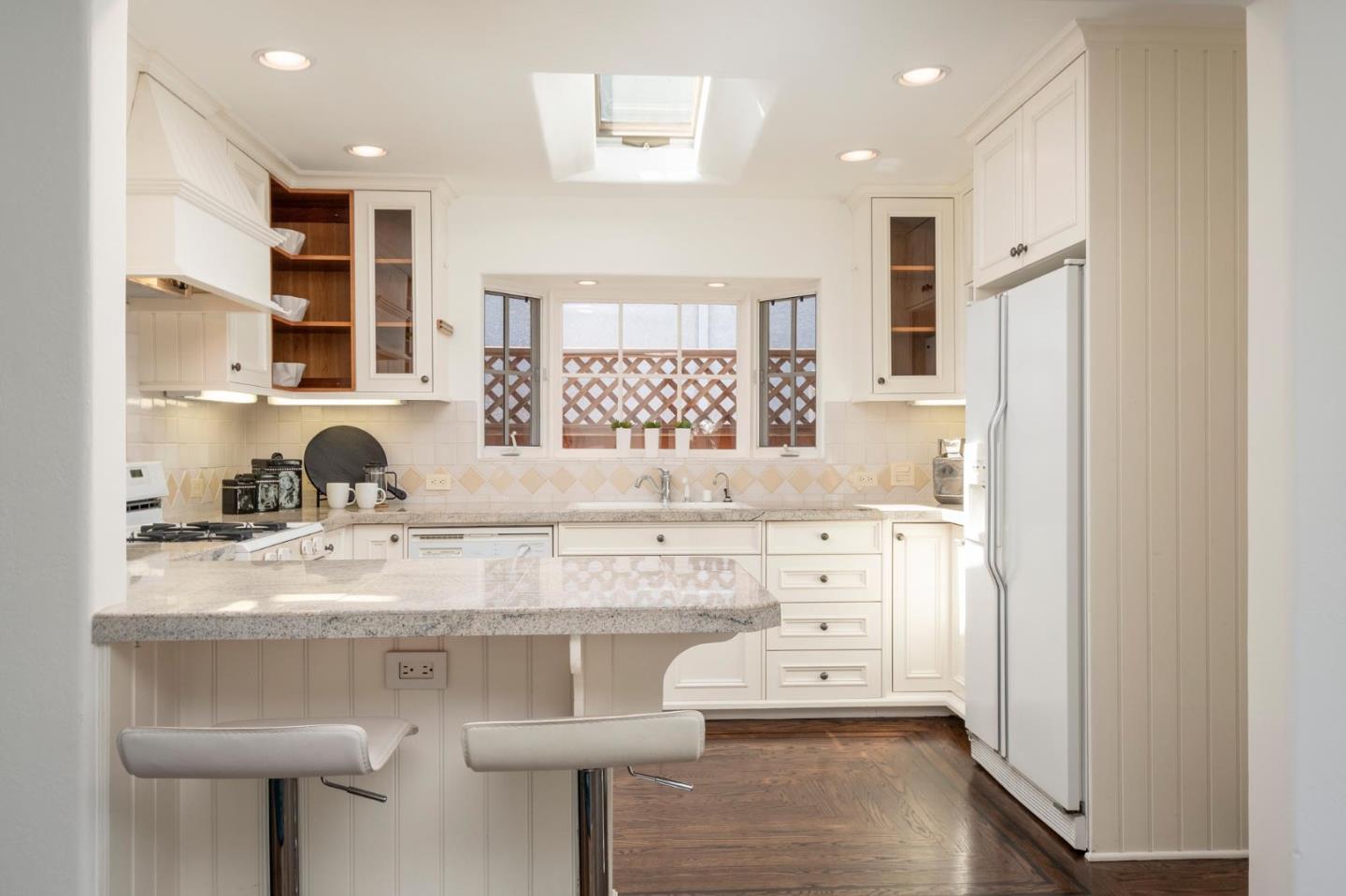 604 9th Avenue Menlo Park, CA 94025 - Photo 14 of 28 a kitchen with stainless steel appliances granite countertop a sink stove and refrigerator