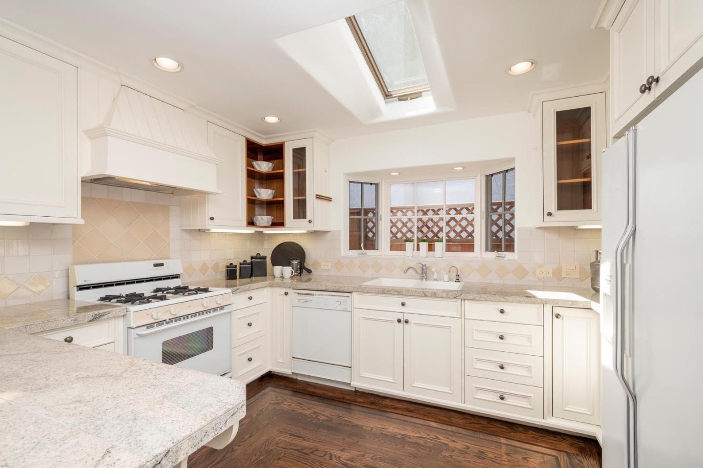 604 9th Avenue Menlo Park, CA 94025 - Photo 15 of 28 a kitchen with white cabinets sink and appliances