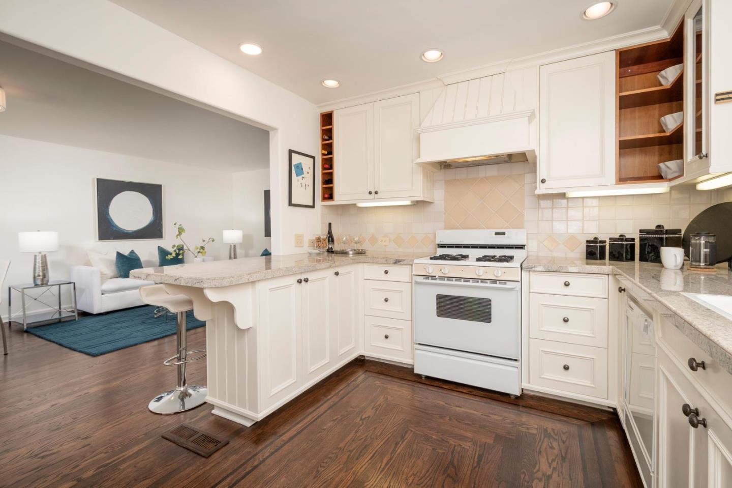604 9th Avenue Menlo Park, CA 94025 - Photo 17 of 28 a kitchen with white cabinets stainless steel appliances and wooden floor
