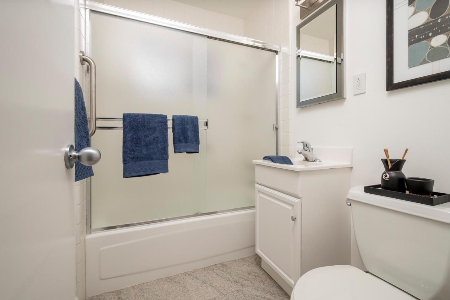 604 9th Avenue Menlo Park, CA 94025 - Photo 22 of 28 a bathroom with a sink a toilet and shower