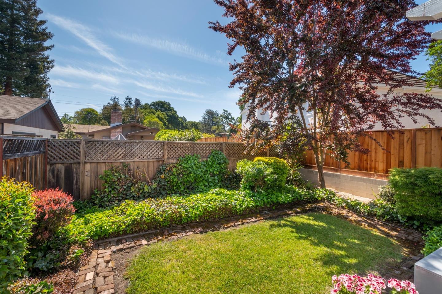 604 9th Avenue Menlo Park, CA 94025 - Photo 24 of 28 a garden with flowers and a bench