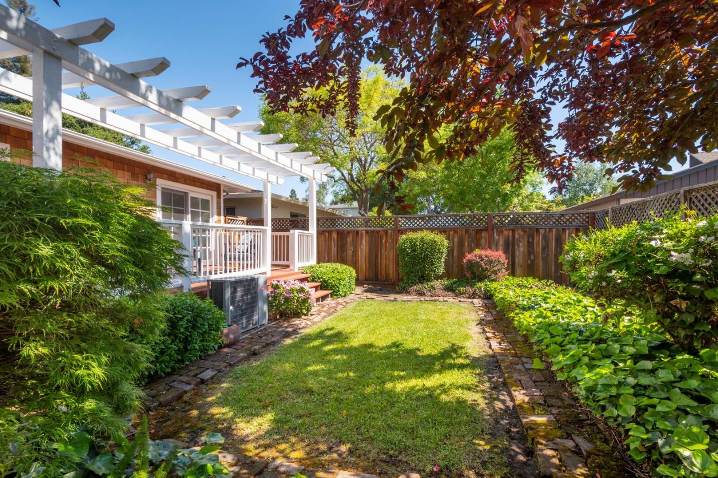 604 9th Avenue Menlo Park, CA 94025 - Photo 25 of 28 a backyard of a house with yard and outdoor seating