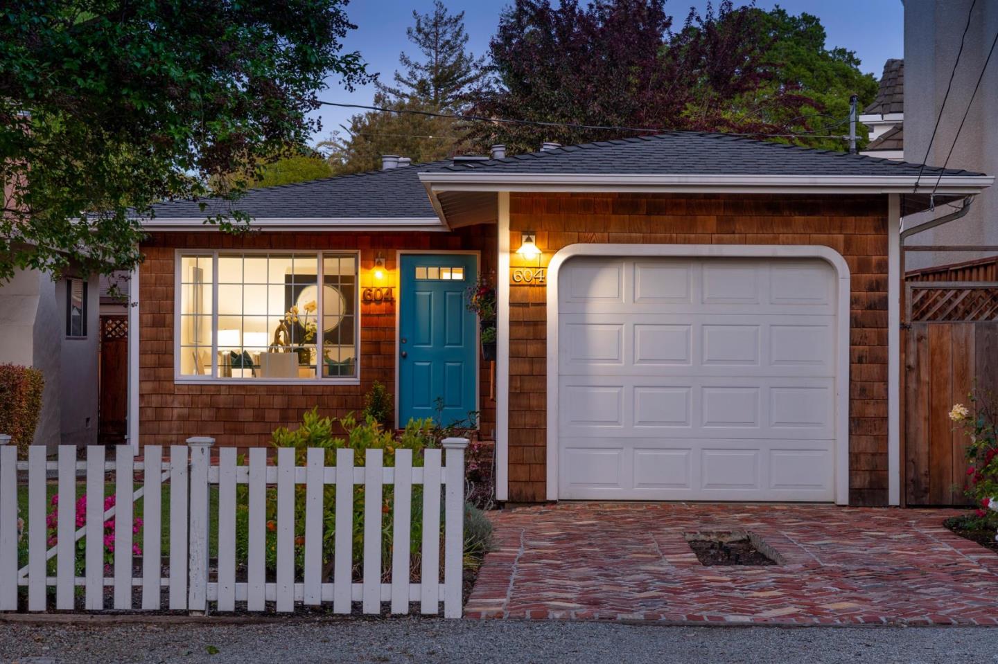 604 9th Avenue Menlo Park, CA 94025 - Photo 4 of 28 a front view of a house with a garden