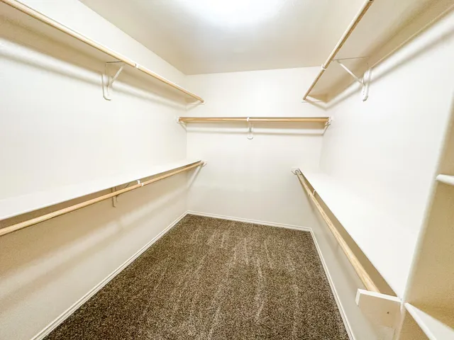 a view of an empty walk in closet
