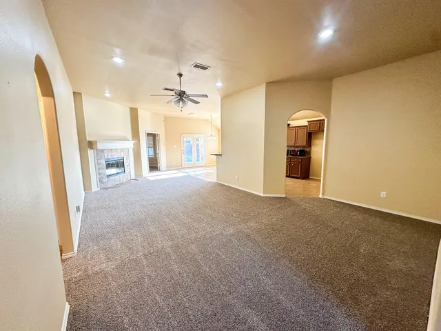 a view of a kitchen with a sink and a fireplace