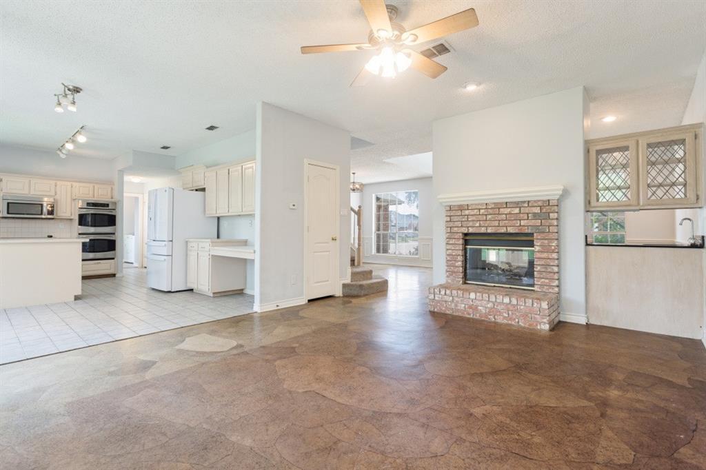 4709 Portrait Lane Plano, TX 75024 - Photo 11 of 22 Open living and kitchen layout make entertaining and every day life a breeze.