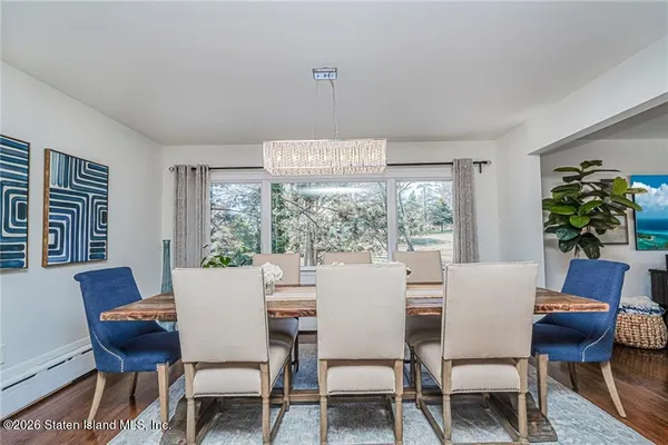 a view of a dining room with furniture window and outside view