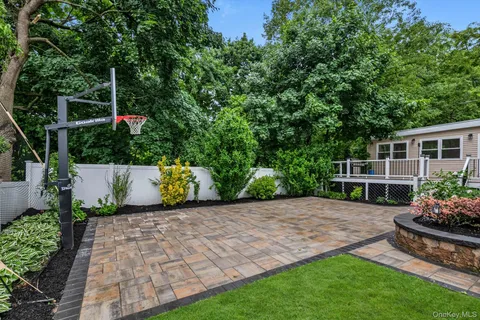 a view of a backyard with sitting area