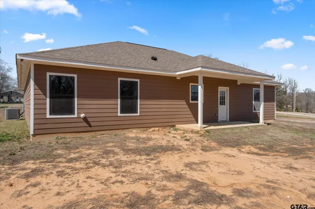 a view of a backyard of the house
