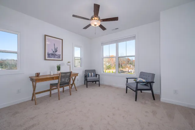a work room with furniture and windows