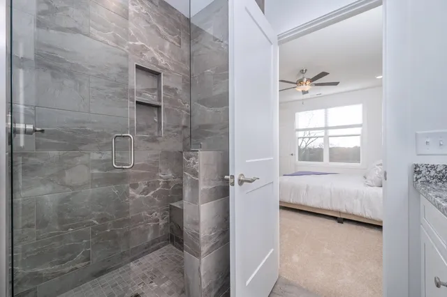 a bathroom with a bathtub and shower