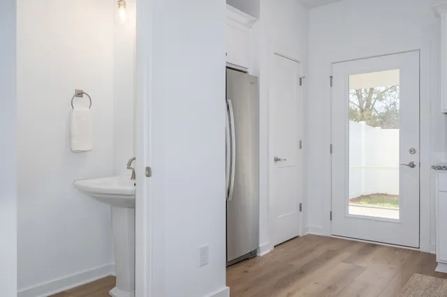 a view of an empty room with window and closet area