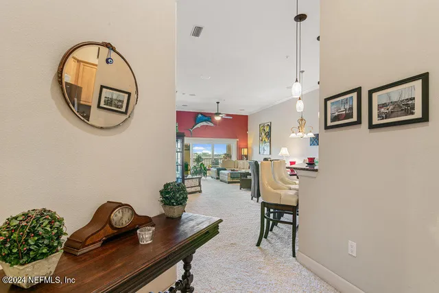 a kitchen with stainless steel appliances granite countertop a stove top oven a sink dishwasher and cabinets with wooden floor