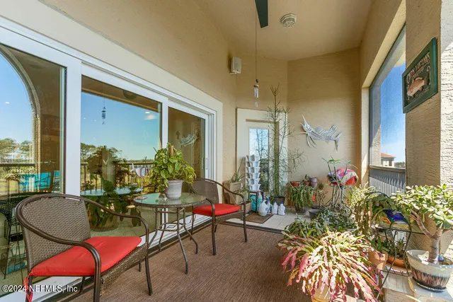 a room with furniture and a potted plant