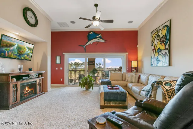 a bedroom with a large bed and a potted plant