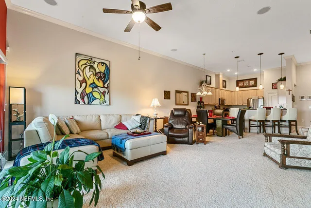a spacious bedroom with a bed and a flat screen tv