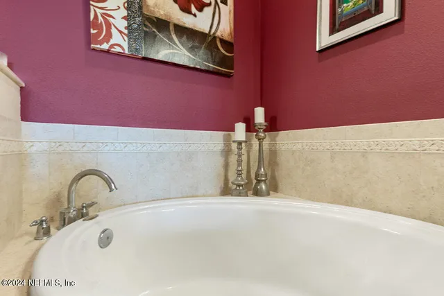 a bedroom with a bed and a desk