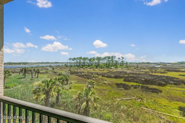 a front view of a house with garden and patio