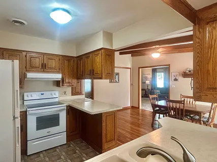 a kitchen with a sink cabinets and appliances