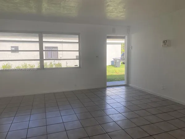 a view of an empty room and window