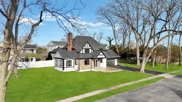a view of a house with a yard porch and sitting area