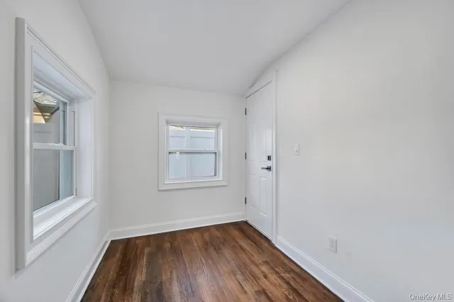 a living room with furniture potted plant and a window