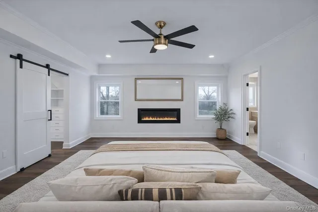 a view of a room with wooden floor and a window