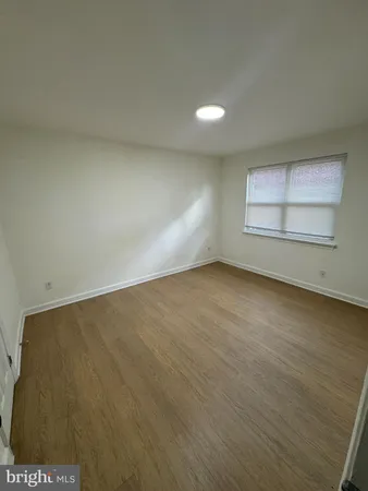 an empty room with a empty space and window