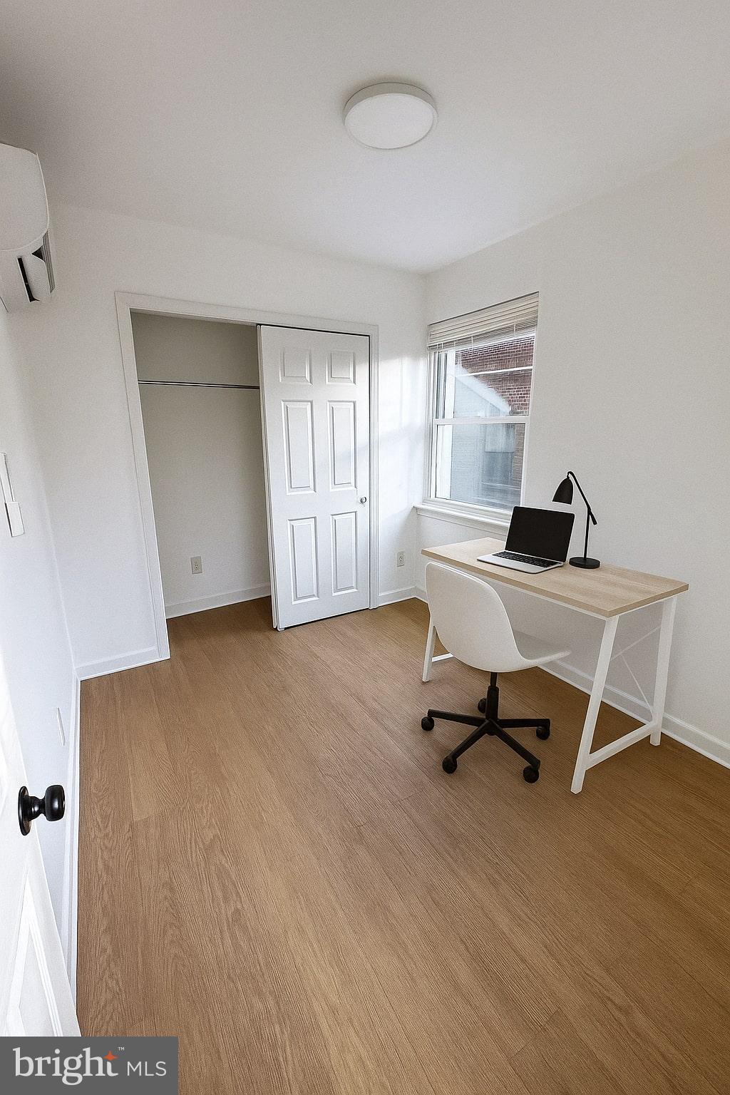1635 6th Street Northwest, Unit 2 Washington, DC 20001 - Photo 3 of 14 a view of a workspace with furniture and a window