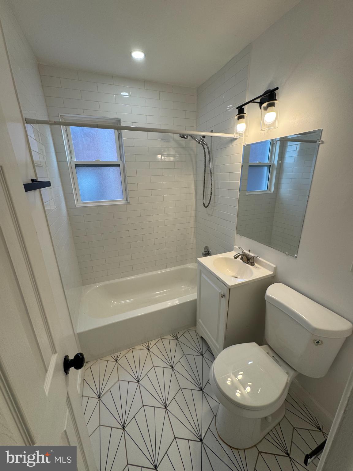 1635 6th Street Northwest, Unit 2 Washington, DC 20001 - Photo 4 of 14 a bathroom with a toilet sink and shower