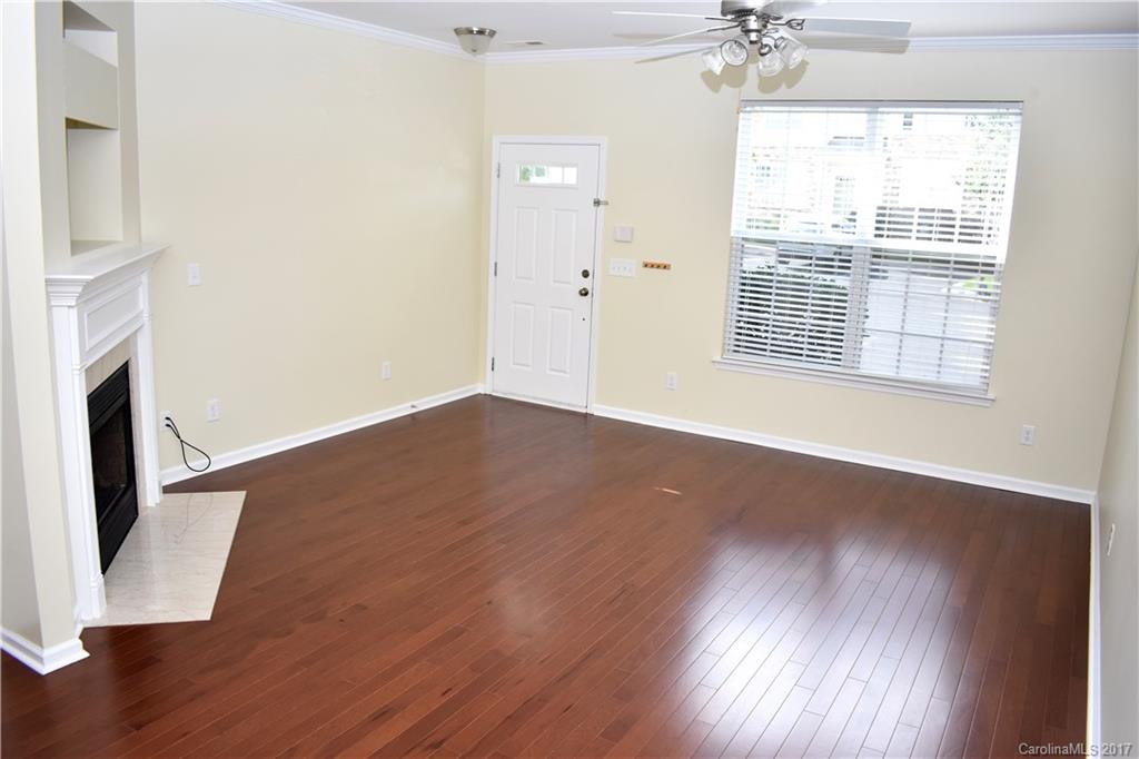 224 Dawn Mist Lane Fort Mill, SC 29708 - Photo 2 of 16 an empty room with wooden floor and windows