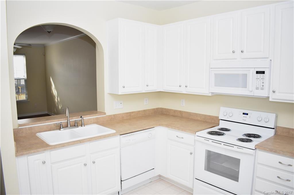 224 Dawn Mist Lane Fort Mill, SC 29708 - Photo 5 of 16 a kitchen with a sink stove and cabinets