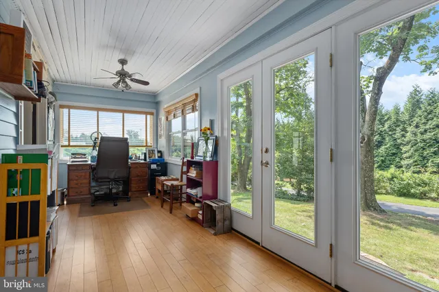 a view of a house with a yard and sitting area