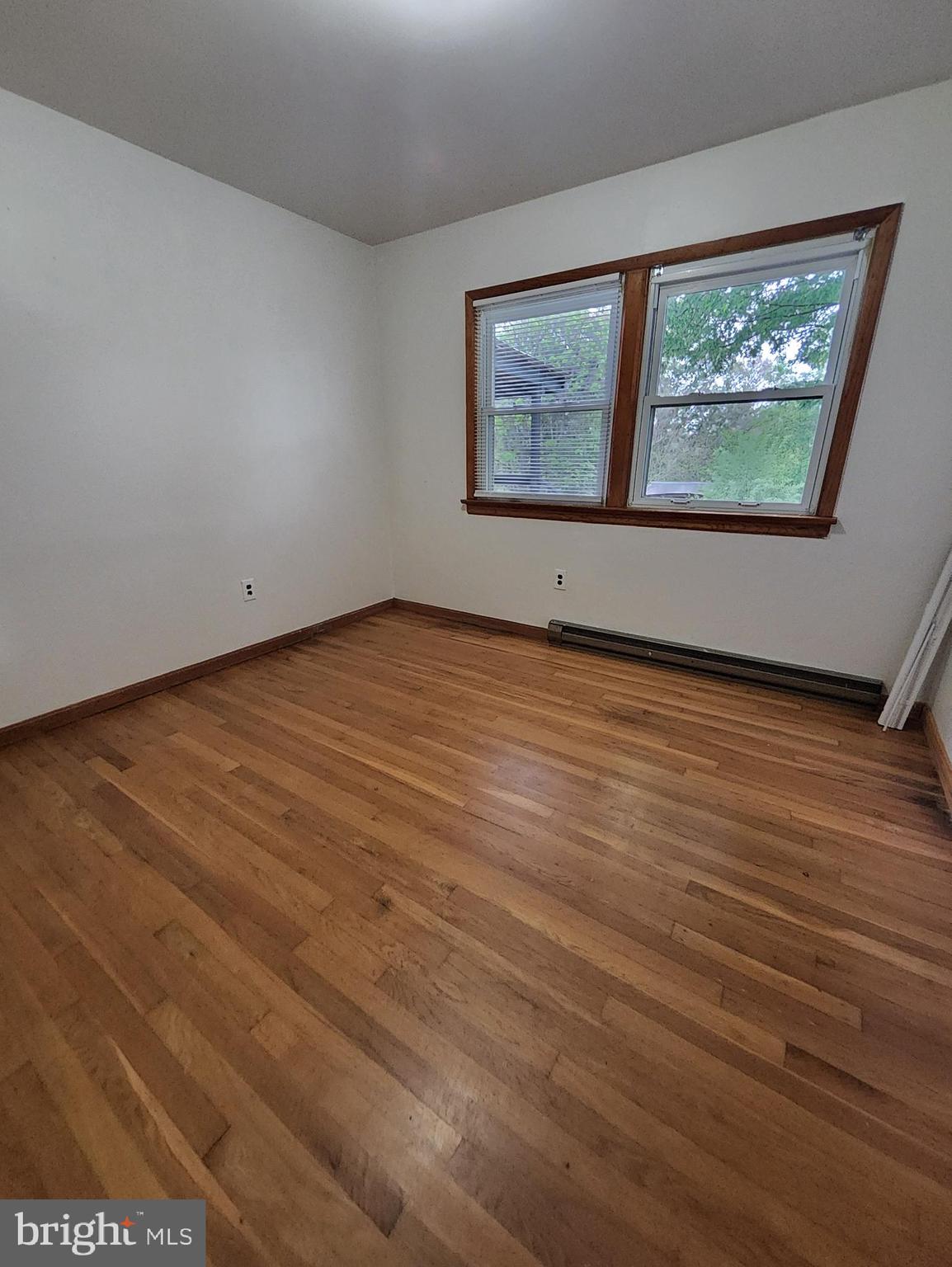 415 View Town Road Amissville, VA 20106 - Photo 15 of 19 an empty room with wooden floor and windows