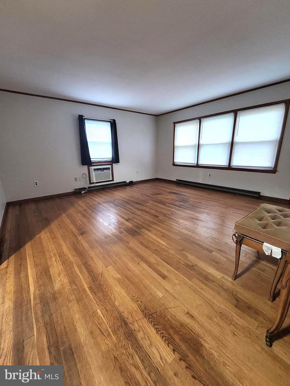 415 View Town Road Amissville, VA 20106 - Photo 3 of 19 wooden floor in an empty room with a window
